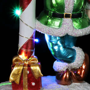 Hand Painted LED Candy Cane Elf Statuary with Merry Christmas Sign on a Battery Powered Timer, 10.5 Inches | Exhart